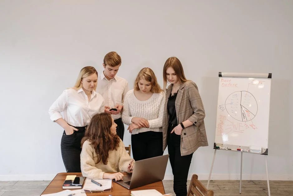Crop anonymous male teacher writing on whiteboard with marker during social media training courses